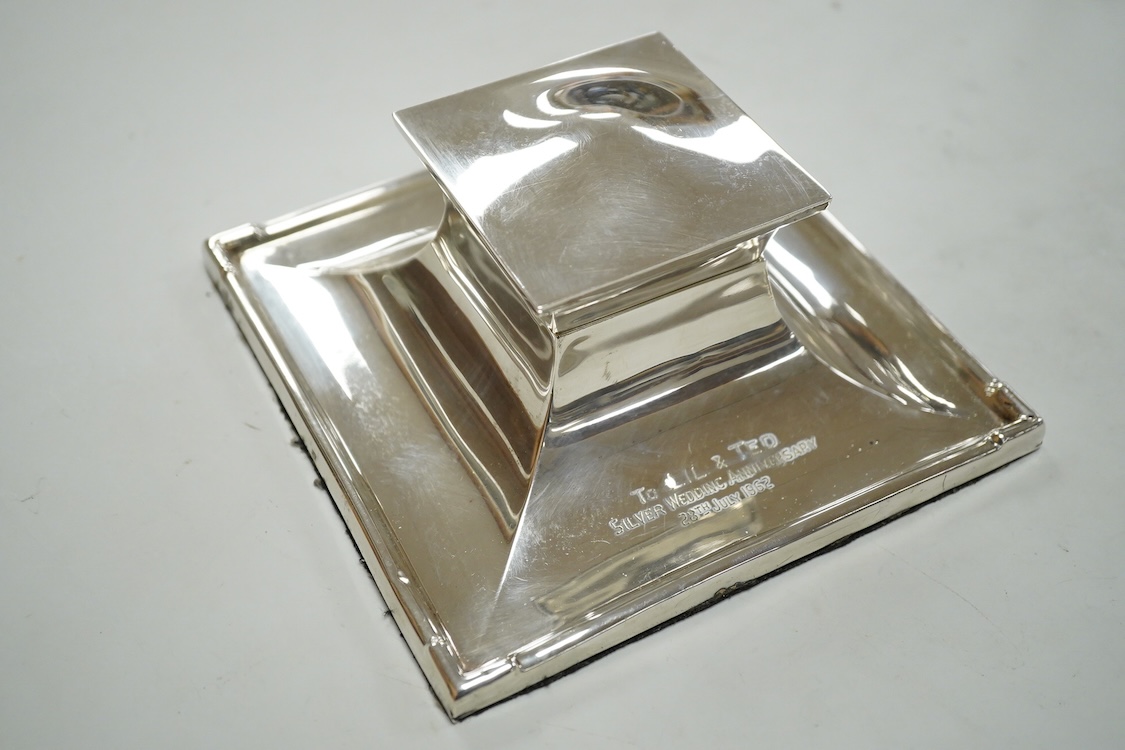 A silver mounted square inkwell by Mappin & Webb, marks rubbed, base 15.1cm, together with an Edwardian silver tulip vase, Sheffield, 1909, weighted